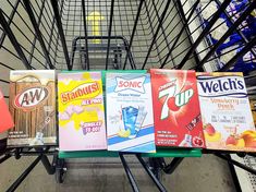 a shopping cart filled with lots of different types of sodas and soft drink packets