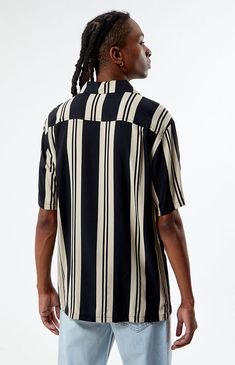 The Black Striped Camp Shirt from PacSun is the epitome of casual cool, featuring a classic collared neckline, short sleeves, and button closures. Its lightweight feel and stylish striped design make it a perfect choice for relaxed and laid-back outings.


	Collared neckline
	Short sleeves
	Regular fit
	Button closures
	Striped
	100% Rayon 
	Machine washable
	Model is wearing size medium
	Model Measurements: 6'1” Height, 29.5" Waist, 32” Hips, 32” Inseam My Mobile Number, Camp Shirt, Camping Shirt, Shirt Price, Stripes Design, Pacsun, Model Measurements, Black Stripes, The Black