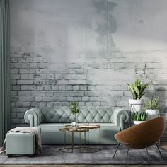 a living room with a couch, chair and coffee table in front of a brick wall