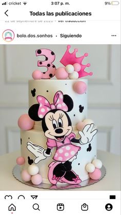 a white and pink cake with minnie mouse on it's top is featured in the instagram