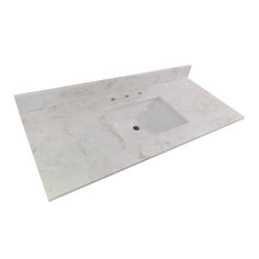 a white sink sitting on top of a marble counter