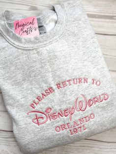 Please Return to Dland/ Dworld Embroidered Crewneck Sweatshirt - Ash Pink Embroidery Disneybound Outfits, Disney Bound Outfits, Cute Shirt Designs, Disney Sweatshirts, Embroidery Sweatshirt, Embroidered Crewneck, Cute Sweatshirts