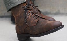 Luxury Leather Work Boots For Streetwear, Luxury Rugged Men's Shoes With Plain Toe, Luxury Leather Work Boots For Fall, Luxury Lace-up Work Boots For Fall, Luxury Lace-up Boots For Workwear, Luxury Lace-up Boots For Adventure, Luxury Casual Plain Toe Lace-up Boots, Luxury Lace-up Workwear Boots, Luxury Lace-up Work Boots