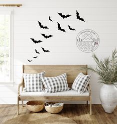 a living room filled with furniture and lots of bats on the wall