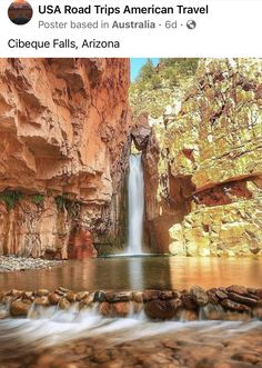 an image of a waterfall in the middle of a canyon with rocks and water flowing from it