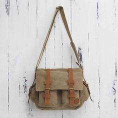 Tan and Brown Leather Accent Roomy Canvas Messenger Bag - Journey to Puno | NOVICA #handmadewithlove #readysettakeoff #supportartisans #handmade Cheap Khaki Canvas Satchel Bag, Cheap Brown Satchel With Zipper Pocket, Cheap Brown Chest Bag With Pockets, Affordable Vintage Canvas Satchel, Casual Light Brown Cheap Satchel, Affordable Khaki Canvas Satchel Bag, Cheap Light Brown Bag With Adjustable Strap, Cheap Brown Satchel With Adjustable Strap, Affordable Brown Vintage Canvas Bag