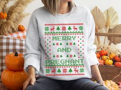 Merry and Pregnant Ugly Christmas Sweater Pregnancy Announcement Sweatshirt - the perfect pregnancy reveal this holiday season! This ugly Christmas sweater design has a special twist - a big 'pregnancy' announcement in the center. This Ugly Christmas Sweater style sweatshirt will get a laugh (and some congratulatory hugs) from your family and friends. So whether you're celebrating your first Christmas as a family or adding another little one to the mix, do it in style with this fun and festive p Ugly Xmas Sweater, Pyjamas Womens, Christmas Party Shirts, Sweater Tshirt, Womens Christmas, Funny Holiday, Xmas Sweater, Holiday Pajamas, Holiday Humor