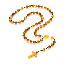 Amber Catholic rosary. These semi-precious Baltic amber rosary beads in the colors shown in the foto. In addition, we enriched it with delicate details - a hand-carved rose flower made of real Baltic Amber with a unique natural texture. Material: Baltic amber Length of the rosary with the cross: 44 cm. Circumference: 59cm. Cross length: 30 mm. Cross width: 19 mm. Bead size: 8mm. Weight: 19g. Baltic amber is renowned for its calming properties and the powerful energy it holds. Imagine feeling the strength of the sea waves with every bead you touch. As you move each amber bead through your fingers, experience a sense of peace and tranquility enveloping you. Additional Information: Gift Packaging: Each rosary is beautifully packaged in a gift box featuring our Mariiel logo, making it a perfec Adjustable Amber Rosary As Gift, Amber Spiritual Rosary For Healing, Yellow Spiritual Rosary As Gift, Spiritual Amber Rosary For Healing, Amber Rosary With 8mm Beads In Spiritual Style, Adjustable Amber Spiritual Rosary, Amber Spiritual Healing Rosary, Spiritual Amber Rosary With 8mm Beads, Traditional Amber Rosary