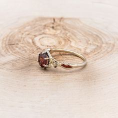 a close up of a ring on a wooden surface