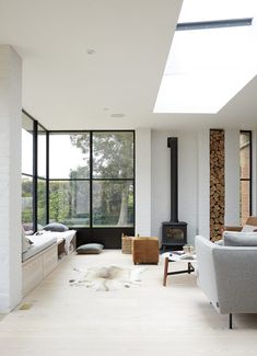 a modern living room with black and white furniture