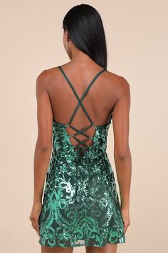 Give everyone a taste of your sensational style by arriving in the Lulus Divine Energy Emerald Sequin Lace-Up A-line Mini Dress! Shiny green sequins create an intricate design across a sheer mesh overlay, that shapes a sleeveless bodice, a straight neckline, and slender straps that form a trendy lace-up design atop the open back. The fitted waist tops a flirty A-line skirt that finishes at a modern mini hem. Hidden back zipper/clasp. Fit: This garment fits true to size. Length: Mid-thigh. Size m Mini Dress Sequin, Homecoming Dresses Sparkly, Short Graduation Dresses, Divine Energy, Dress Sequin, Formal Dresses Short, Adhesive Bra, Green Sequins, Sparkly Dress