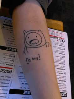 a person with a tattoo on their arm that says lead is mine and has a bear drawn on it