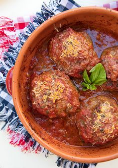 meatballs in tomato sauce with basil and parmesan cheese