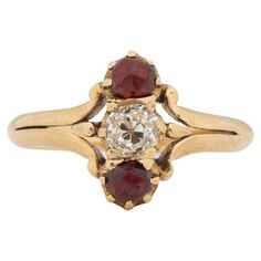 Ring Size: 5.5 Metal Type: 14K Yellow Gold [Hallmarked, and Tested] Weight: 2.7 grams Center Diamond Details: Weight: .40ct Cut: Old Mine Brilliant (Antique Cushion) Color: J Clarity: SI Side Stone Details: Weight: .50ct, total weight Cut: Antique European Cut Color: Red Type: Garnet Finger to Top of Stone Measurement: 5mm Condition: Excellent Crossover Engagement Ring, Brown Diamond Engagement Ring, Contemporary Wedding Rings, Edwardian Engagement Ring, Contemporary Engagement Rings, Gold Solitaire Engagement Ring, Yellow Gold Engagement Ring, Yellow Gold Solitaire, Engagement Ring Sizes