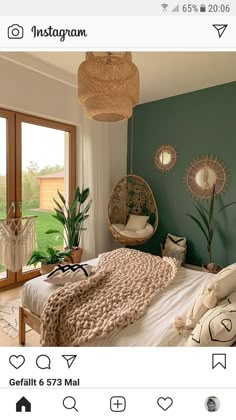 a bed room with a neatly made bed and a hanging chair next to a window