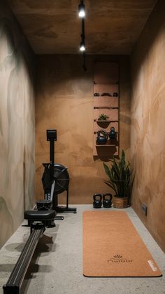 an indoor gym with exercise equipment and yoga mat