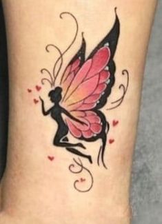 a woman's foot with a pink and black butterfly tattoo on the side of her leg