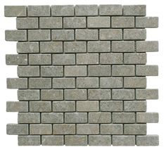 a white brick wall that has been made out of grey marble blocks and is facing the camera