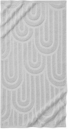 a white blanket with wavy lines on it