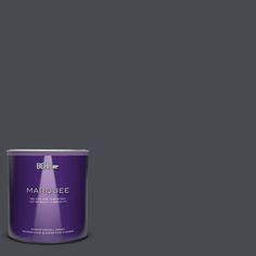 a can of marquee paint on a dark green background