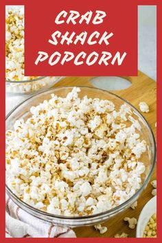 a bowl filled with popcorn sitting on top of a wooden cutting board next to another bowl full of popcorn