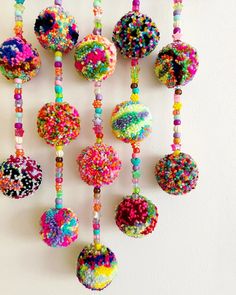 there are many beads hanging on the wall and one is made out of doughnuts