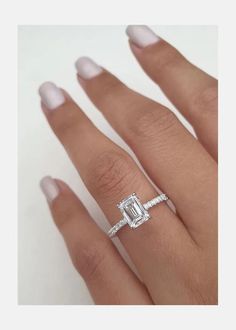 a woman's hand with an engagement ring on it and the side view of her finger