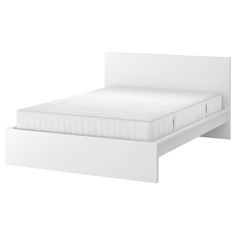 a white bed frame with no sheets on it