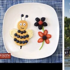 a white plate topped with fruit and a bee cut in to the shape of flowers