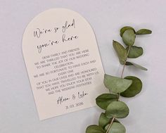 there is a card that has been placed on top of the paper with some leaves