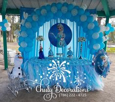 a frozen princess birthday party with balloons and decorations