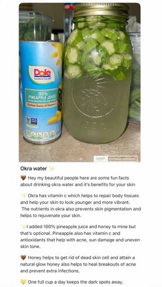 a jar filled with cucumbers sitting on top of a counter next to a can