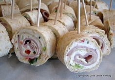 several sandwiches with toothpicks sticking out of them