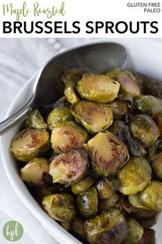 brussel sprouts in a white bowl with a spoon on the side