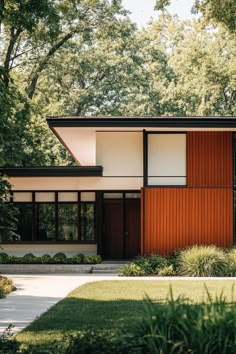 the exterior of a modern house with red and white siding