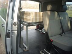 the interior of a van with seats folded down