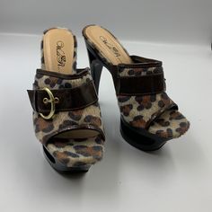 Very Cute Platform Mule/Slides. Faux Calf Skin With Leopard Print. Functional Gold Buckle Across Upper. Very High 5.5” Heel With 2” Platform. Interesting Open Feature In Platform And Upper Heel. Shoes Are Brand New With No Discernible Wear Other Than Try On. They Are Too Big For My Wife, And She Wasn’t Crazy About The Open Design. Ms-27 Brown Synthetic Slide Mules, Brown Round Toe Mules For Party, Brown Synthetic Mules With Buckle Closure, Brown Synthetic Platform Mules, Brown Synthetic Slip-on Heels, Brown Platform Mules For Party, Heels Ideas, Mule Slides, Cute High Heels