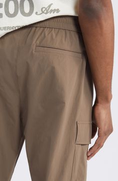 Roomy and relaxed, these cargo pants made with lightweight rayon sport lots of comfortable stretch plus plenty of pockets for stowing essentials. Elastic/drawstring waist Side-seam pockets; cargo flap-patch pockets Drawcord-toggle hems 68% rayon, 30% nylon, 2% spandex Machine wash, tumble dry Imported