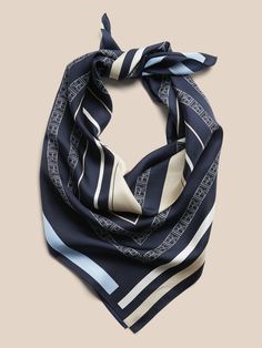 Accent your look with this large square scarf, made with luxuriously soft silk.  Length: 30" (76cm) Width: 30" (76cm) Hand wash cold, line dry.