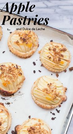 apple pastries and dulces de leche on a baking sheet