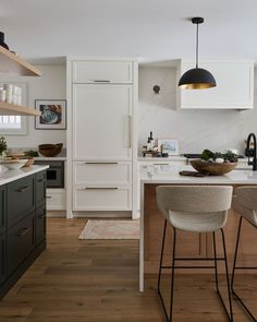 the kitchen is clean and ready to be used for cooking or eating, while also being used as a dining area