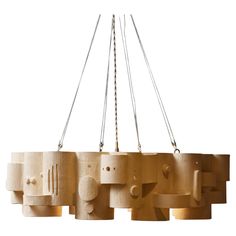 a chandelier made out of wood with multiple lights hanging from the top and bottom