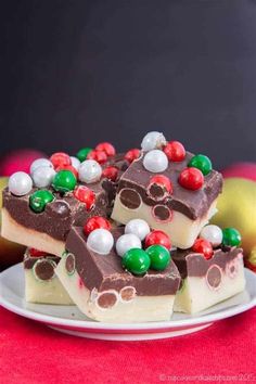 a white plate topped with pieces of chocolate and candy