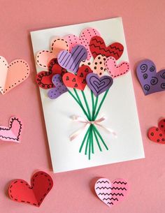 valentine's day card with paper hearts and flowers