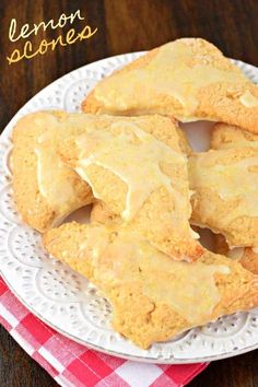 lemon scones are sitting on a white plate