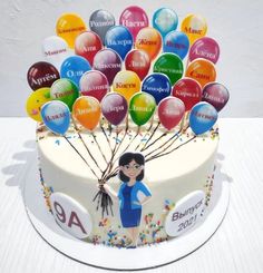 a birthday cake with an image of a woman holding balloons on it's side