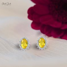 Description Illuminate her beauty with our Real 14k Gold Yellow Sapphire Earrings. Featuring 1.16 Ct oval gemstones encircled by sparkling halo diamonds, these handmade earrings are the perfect personalized gift for women who love fine jewelry. Ideal for any occasion, a timeless treasure Product Details SKU CJ-E-1157A-YS Metal 14K Solid Gold Closing mechanism Push Back Product dimension 9.55mm x 7.43mm x 3.79mm Birthstone September Certification N/A YELLOW SAPPHIRE DETAILS Stone size 6x4mm Quali Yellow Oval Halo Jewelry, Oval Halo Earrings In Fine Jewelry Style, Oval Cubic Zirconia Gemstone Earrings, Yellow Oval Gemstone Earrings, Oval Sterling Silver Earrings, Oval Halo Sterling Silver Earrings, Oval Gemstone Earrings For Anniversary, Yellow Oval Fine Jewelry Earrings, Yellow Oval Earrings In Fine Jewelry Style