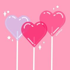 three heart shaped lollipops sitting on top of each other in the shape of hearts