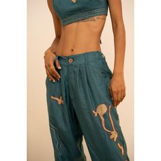 Our favorite silk trousers features hand-embroidered designs inspired by the ocean, its corals, and marine life by Lambani artisans, while the Eri (peace) Silk composition provides a soft and luxurious feel. The vivid ocean blue hue (created from a combination of marigold and indigo natural dyes) adds a perfect touch of vibrancy. Whether paired with the Coral Bralette and the Coral Silk Shirt or worn on its own with another top in your closet, this is a stylish statement piece is an artful and t Embroidered Designs, July Birthstone Jewelry, The Coral, Silk Trousers, By The Ocean, Jewelry Ring Box, Gifts For New Mums, Pearl Jewellery Earrings, August Birth Stone