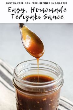 homemade teriyaki sauce in a mason jar with a spoon pouring it into the jar